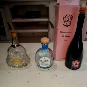 Empty liquor bottles glass Hennessy XO Don Julio Tequila Lamborghini champagne